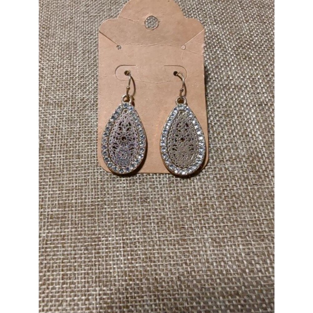 silver-tone teardrop dangle earrings with a lace design and rhinestone accents
